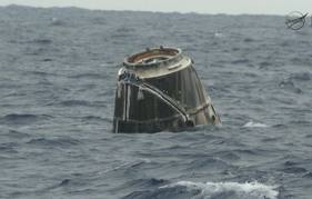 Space Capsule Splashes Down